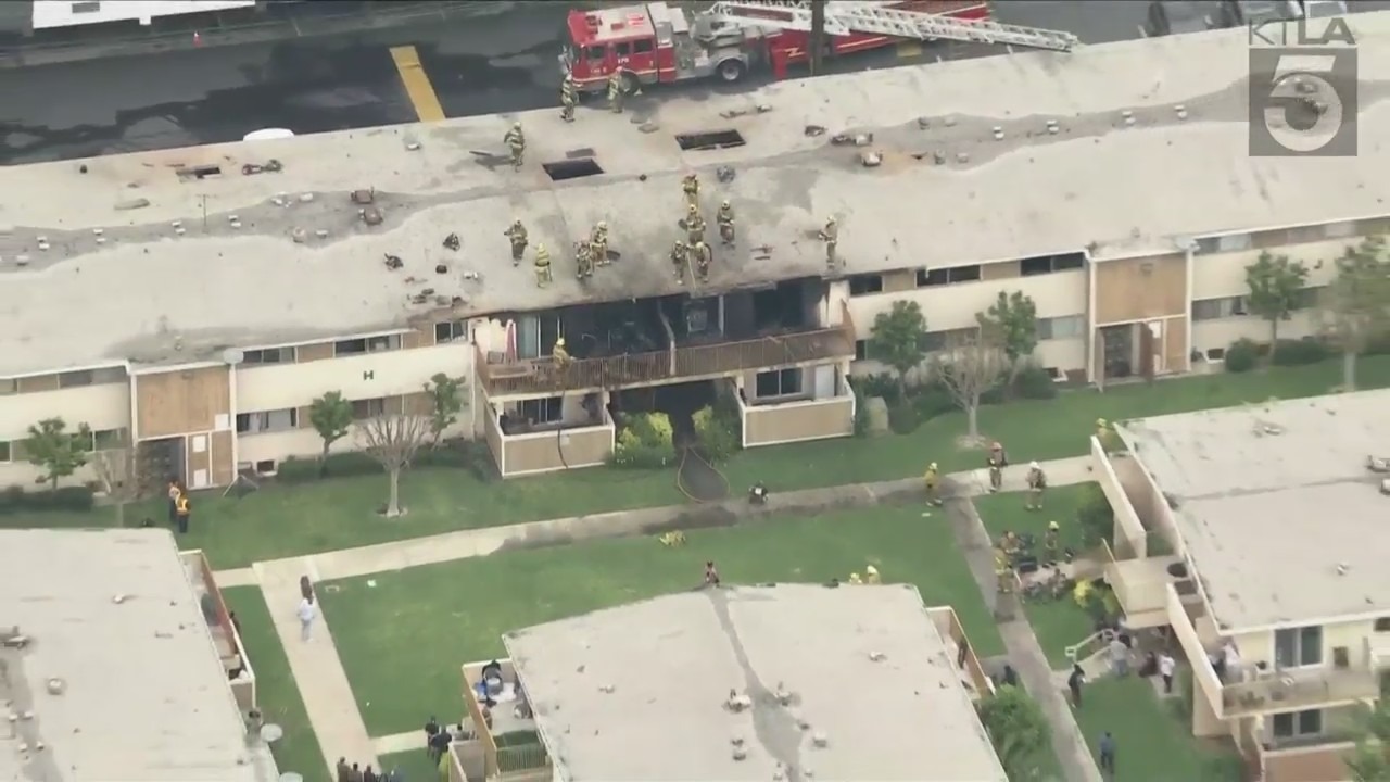 Firefighters battling a massive apartment building fire in Gardena
