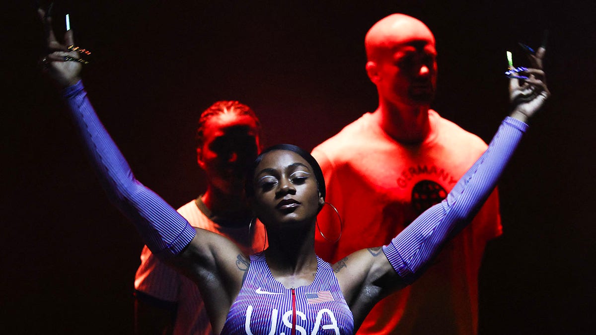 Sha'Carri Richardson poses in a Nike uniform