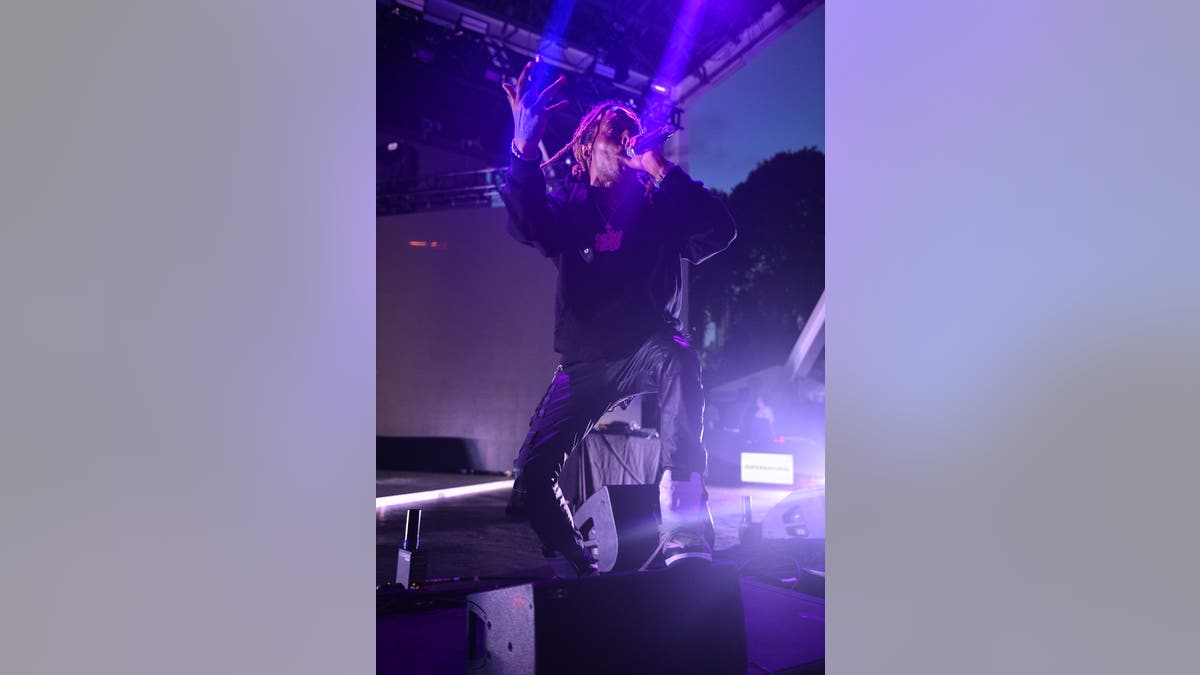 Rapper Chris King performs live on stage